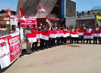Polres Toba Bersama Forkopimda Bagikan 10 Juta Bendera Merah Putih