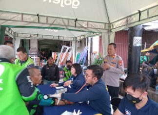 Hari Bhayangkara ke-79, Polisi Layani Pemeriksaan Kesehatan Ratusan Pengemudi Ojek Online di Kota Tangerang